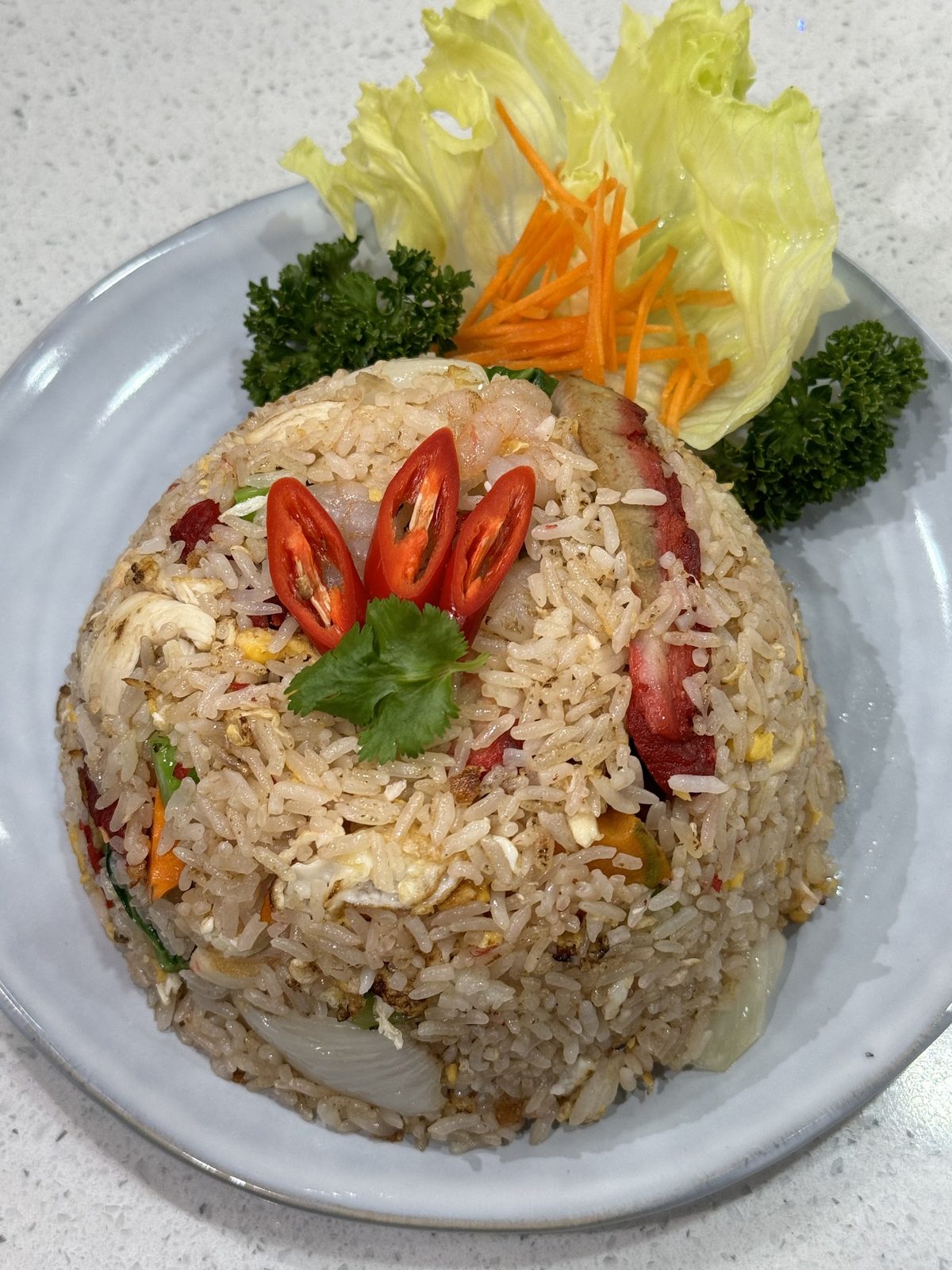 Fried rice with prawn and BBQ pork, garnished with chilli