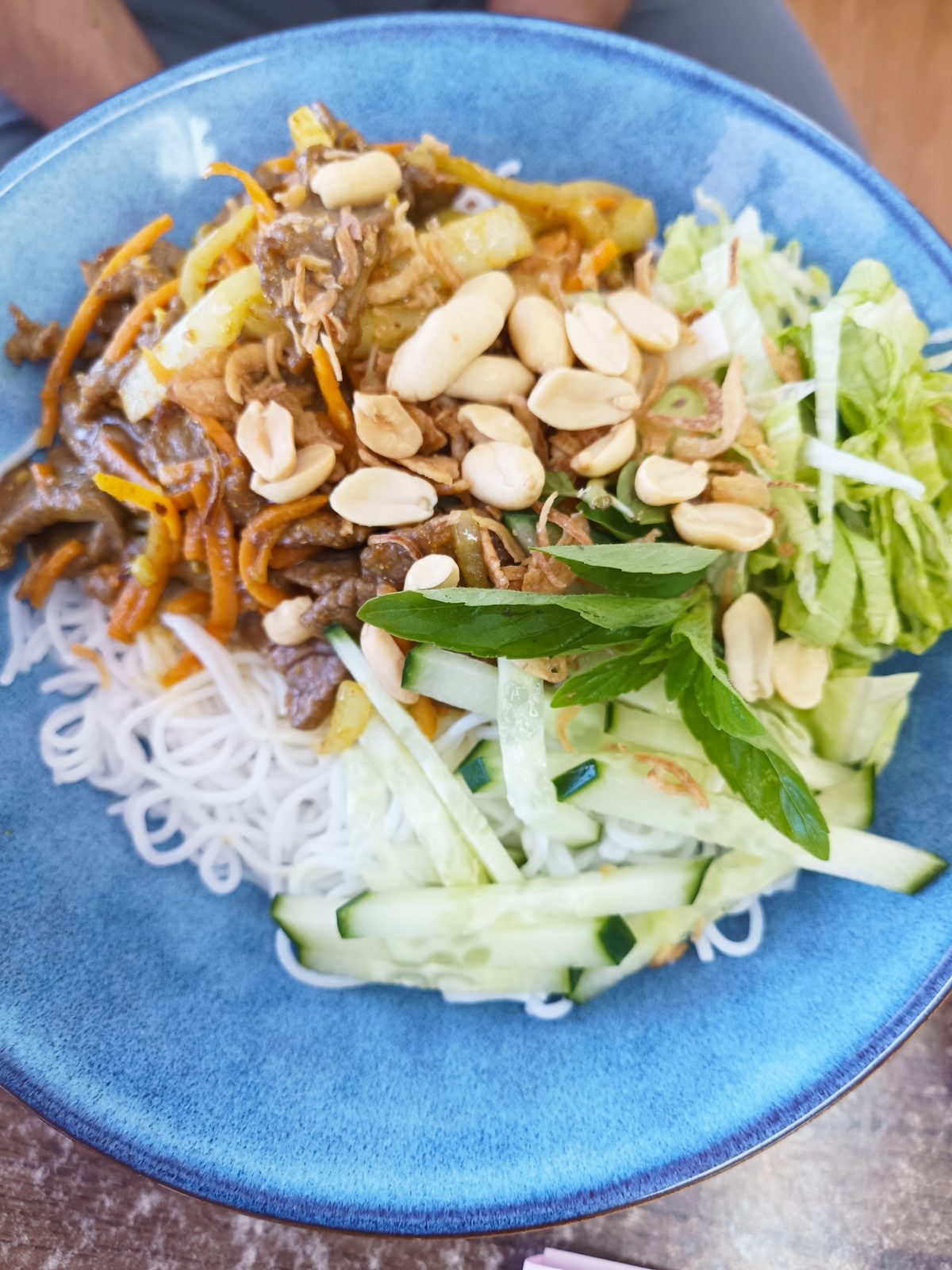 Beef vermicelli salad with peanuts, cucumber and herbs