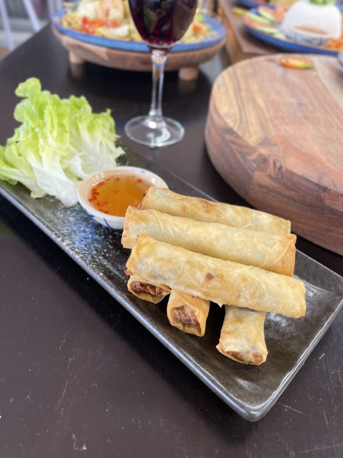 Fried spring rolls with lettuce and dipping sauce